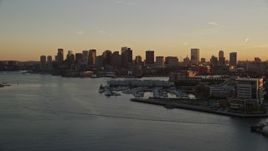6k aerial stock footage flying over Charles River, approaching Downtown Boston, Massachusetts, sunset Aerial Stock Footage | AX146_077