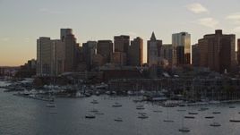 6k aerial stock footage flying by the downtown skyline, Downtown Boston, Massachusetts, sunset Aerial Stock Footage | AX146_080E