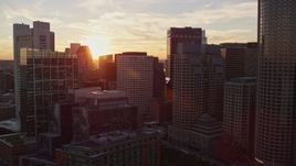6k aerial stock footage flying by skyscrapers, Rowes Wharf, Downtown Boston, Massachusetts, sunset Aerial Stock Footage | AX146_082E