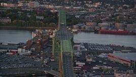 6k aerial stock footage flying by the Tobin Memorial Bridge, Charlestown, Massachusetts, sunset Aerial Stock Footage | AX146_089