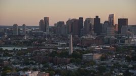 6k aerial stock footage orbiting the Bunker Hill Monument, skyline, Charlestown, Massachusetts, sunset Aerial Stock Footage | AX146_090E