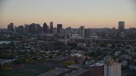 6k aerial stock footage flying by Bunker Hill Monument, downtown skyline, Charlestown, Massachusetts, sunset Aerial Stock Footage | AX146_093E