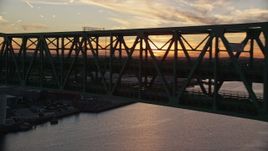 6k aerial stock footage flying by the Tobin Memorial Bridge, Charlestown, Massachusetts, sunset Aerial Stock Footage | AX146_105E