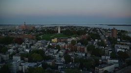6k aerial stock footage of Dorchester Heights Monument, row houses, South Boston, Massachusetts, twilight Aerial Stock Footage | AX146_115E