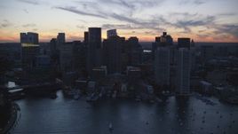 6k aerial stock footage flying by Rowes Wharf, skyline, Downtown Boston, Massachusetts, twilight Aerial Stock Footage | AX146_135