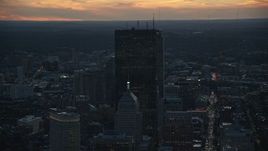 6k aerial stock footage flying by skyscrapers, Downtown Boston, Massachusetts, twilight Aerial Stock Footage | AX146_142E
