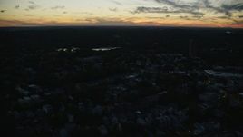 6k aerial stock footage flying by neighborhood, Jamaica Pond, Jamaica Plain, Massachusetts, twilight Aerial Stock Footage | AX146_151