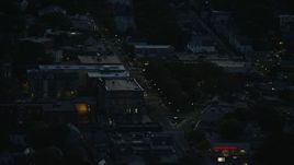 6k aerial stock footage flying by Washington Street, Roslindale, Massachusetts, night Aerial Stock Footage | AX146_154E