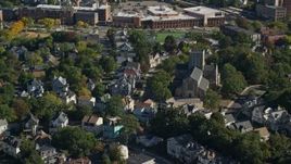 6K aerial stock footage flying over suburban homes, church and tree lined streets, Dorchester, Massachusetts Aerial Stock Footage | AX147_004