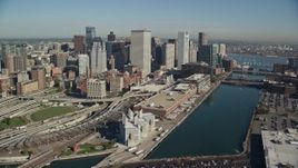 6K aerial stock footage flying over industrial area to Downtown Boston skyscrapers, Fort Point Channel, Massachusetts Aerial Stock Footage | AX147_006E