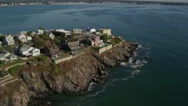 6K aerial stock footage flying by mansions in a coastal community on the bay, Nahant, Massachusetts Aerial Stock Footage | AX147_018