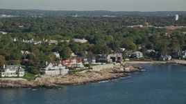 6K aerial stock footage flying by mansions along the coast, Marblehead, Massachusetts Aerial Stock Footage | AX147_022