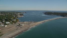 6K aerial stock footage flying along a coastal community and boats in the harbor, Marblehead Harbor, Marblehead, Massachusetts Aerial Stock Footage | AX147_023E