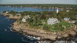 6K aerial stock footage orbiting away from oceanfront mansions among fall foliage, Manchester-by-the-Sea, Massachusetts Aerial Stock Footage | AX147_063