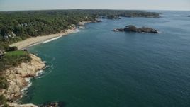 6K aerial stock footage flying by oceanfront homes to Graves Island, Manchester-by-the-Sea, Massachusetts Aerial Stock Footage | AX147_074E