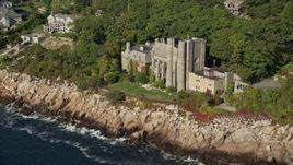 6K aerial stock footage flying by Hammond Castle, rocky coastline, Gloucester, Massachusetts Aerial Stock Footage | AX147_081