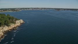 6K aerial stock footage flying by coastal town, approach Gloucester Harbor, Gloucester, Massachusetts Aerial Stock Footage | AX147_082E