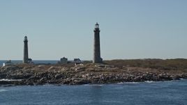 6K aerial stock footage orbiting two light houses on Thatcher Island, Massachusetts Aerial Stock Footage | AX147_112E