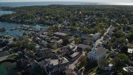 6K aerial stock footage of a coastal town and white church near the harbor, Rockport, Massachusetts Aerial Stock Footage | AX147_120E