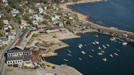 6K aerial stock footage of a small coastal town along a cove and the ocean, Rockport, Massachusetts Aerial Stock Footage | AX147_130