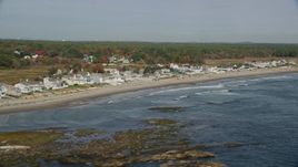 6K aerial stock footage flying by ocean and beachfront homes in autumn, Rye, New Hampshire Aerial Stock Footage | AX147_165E