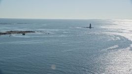 6k aerial stock footage approaching a lighthouse in the middle of the water, Kittery, Maine Aerial Stock Footage | AX147_193