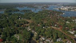 6K aerial stock footage flying over autumn trees in a coastal town, New Castle, Portsmouth, New Hampshire Aerial Stock Footage | AX147_199