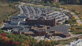 6K aerial stock footage flying away from Portsmouth Regional Hospital, autumn, Portsmouth, New Hampshire Aerial Stock Footage | AX147_209