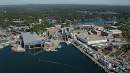 6k aerial stock footage approaching Portsmouth Naval Shipyard, autumn, Kittery, Maine Aerial Stock Footage | AX147_223
