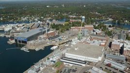 6k aerial stock footage flying by Portsmouth Naval Shipyard, autumn, Kittery, Maine Aerial Stock Footage | AX147_224