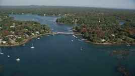 6k aerial stock footage flying by small bridge, waterfront communities, autumn, Kittery, Maine Aerial Stock Footage | AX147_225