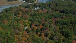 6k aerial stock footage flying over colorful forest, rural homes, reveal York Harbor, Kittery and York, Maine Aerial Stock Footage | AX147_230