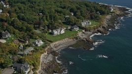 6K aerial stock footage approaching upscale oceanfront homes, tilt down, autumn, York, Maine Aerial Stock Footage | AX147_233