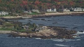 6K aerial stock footage flying by Bush Compound, rocky coast, autumn, Kennebunkport, Maine Aerial Stock Footage | AX147_255E