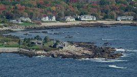 6k aerial stock footage flying by the Bush Compound, rocky coastline, autumn, Kennebunkport, Maine Aerial Stock Footage | AX147_256