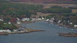 6K aerial stock footage flying by waterfront homes, small cove, autumn, Kennebunkport, Maine Aerial Stock Footage | AX147_259E
