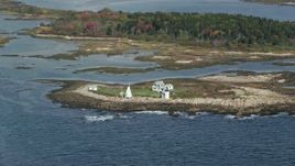 6k aerial stock footage flying by Goat Island Light, autumn, Kennebunkport, Maine Aerial Stock Footage | AX147_261