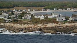 6K aerial stock footage flying by oceanfront homes, autumn, Biddeford, Maine Aerial Stock Footage | AX147_265