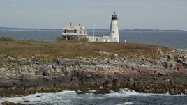 6K aerial stock footage revealing and approaching Wood Island Light, autumn, Biddeford, Maine Aerial Stock Footage | AX147_270E