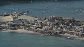6K aerial stock footage flying by oceanfront homes, boats in harbor, autumn, Saco, Maine Aerial Stock Footage | AX147_275
