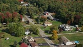 6K aerial stock footage flying by rural homes, Guinea Road, autumn, Biddeford, Maine Aerial Stock Footage | AX147_291E