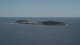 6K aerial stock footage flying by Richmond Island, Cape Elizabeth, Maine Aerial Stock Footage | AX147_300