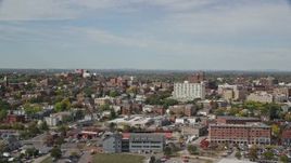6K aerial stock footage flying by apartments, office buildings, autumn trees, Portland, Maine Aerial Stock Footage | AX147_324