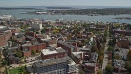 6K aerial stock footage orbiting downtown, colorful autumn trees, Portland, Maine Aerial Stock Footage | AX147_328E