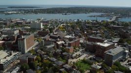 6k aerial stock footage orbiting Portland Harbor, downtown buildings, autumn, Portland, Maine Aerial Stock Footage | AX147_329