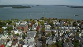 6k aerial stock footage flying over coastal neighborhood to Eastern Promenade, bay,  Portland, Maine Aerial Stock Footage | AX147_342