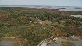 6K aerial stock footage flying over rural homes, approaching small islands, autumn, Chebeague Island, Maine Aerial Stock Footage | AX147_369