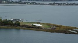 6k aerial stock footage flying by a pavilion on an island, revealing a marina, autumn, Harpswell, Maine Aerial Stock Footage | AX147_374