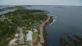 6k aerial stock footage flying by coastal town, Bailey Island in autumn, Harpswell, Maine Aerial Stock Footage | AX147_378