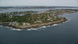 6K aerial stock footage flying by coastal town, Bailey Island in autumn, Harpswell, Maine Aerial Stock Footage | AX147_378E